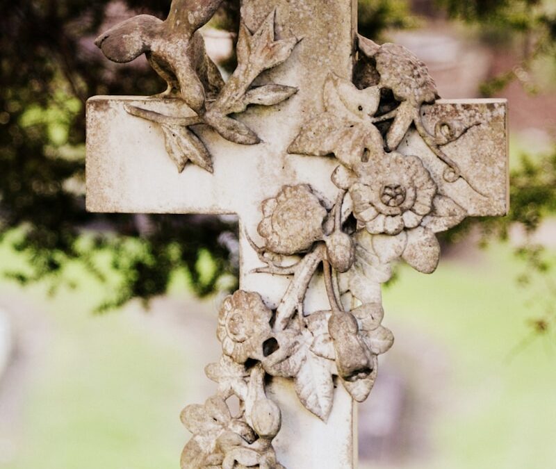beige and white floral concrete cross