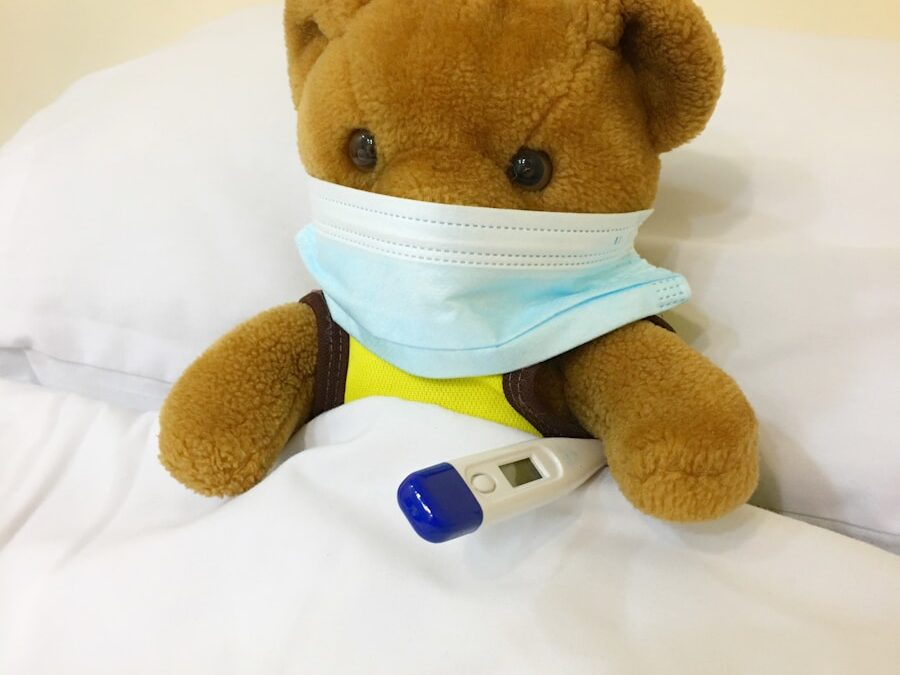 brown bear plush toy on white textile
