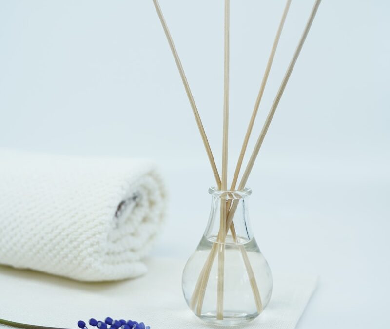 white tissue paper roll beside clear glass vase