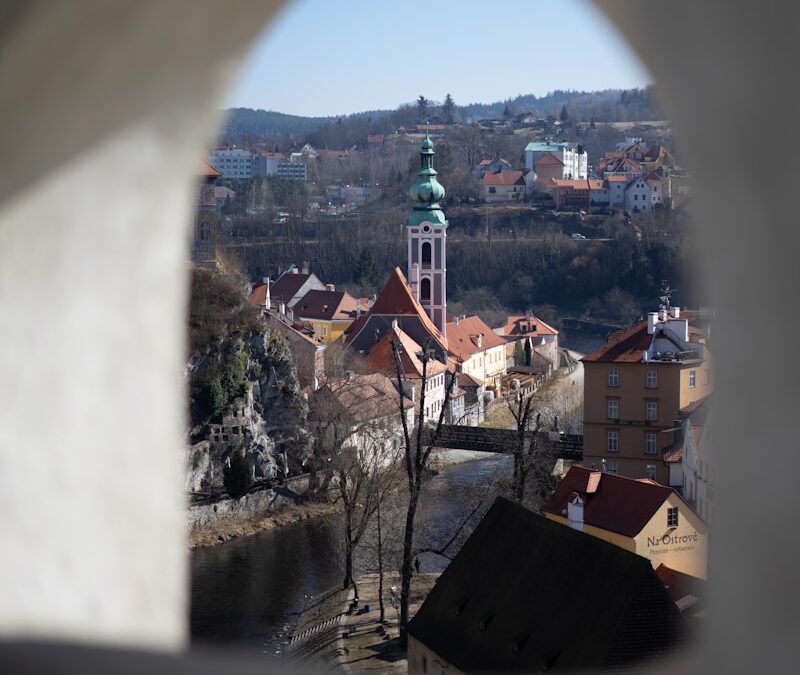 a view of a city through a hole in a wall