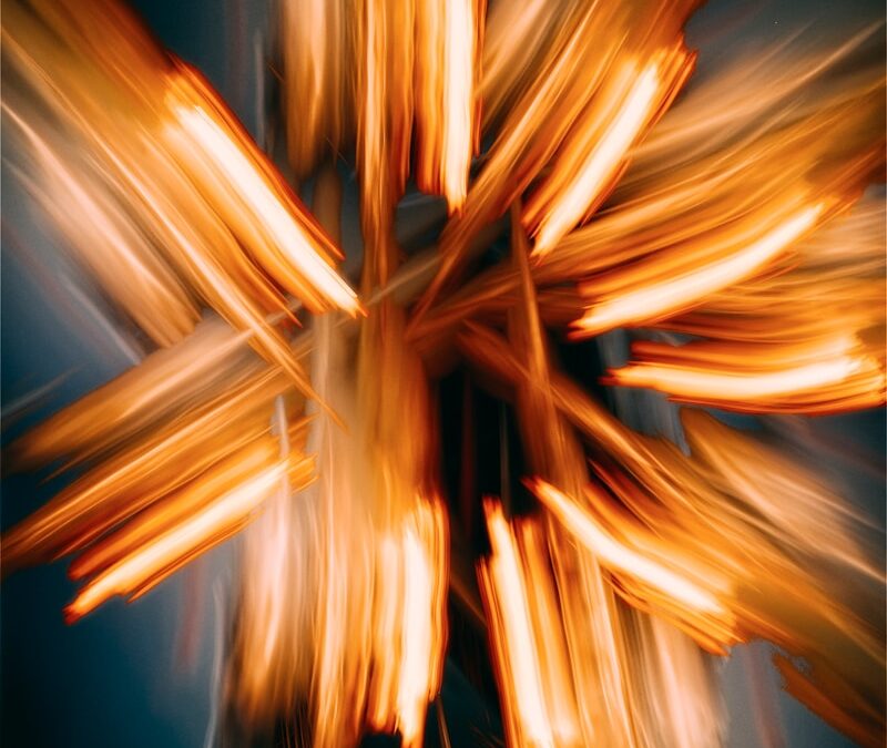 A blurry photo of a cross made of wood