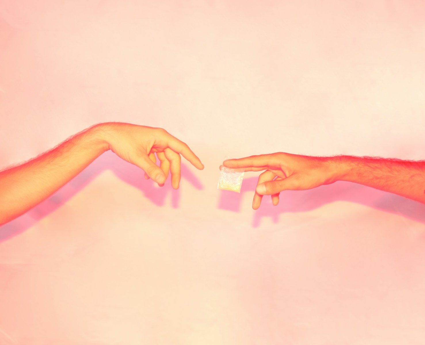 two hands reaching out towards each other