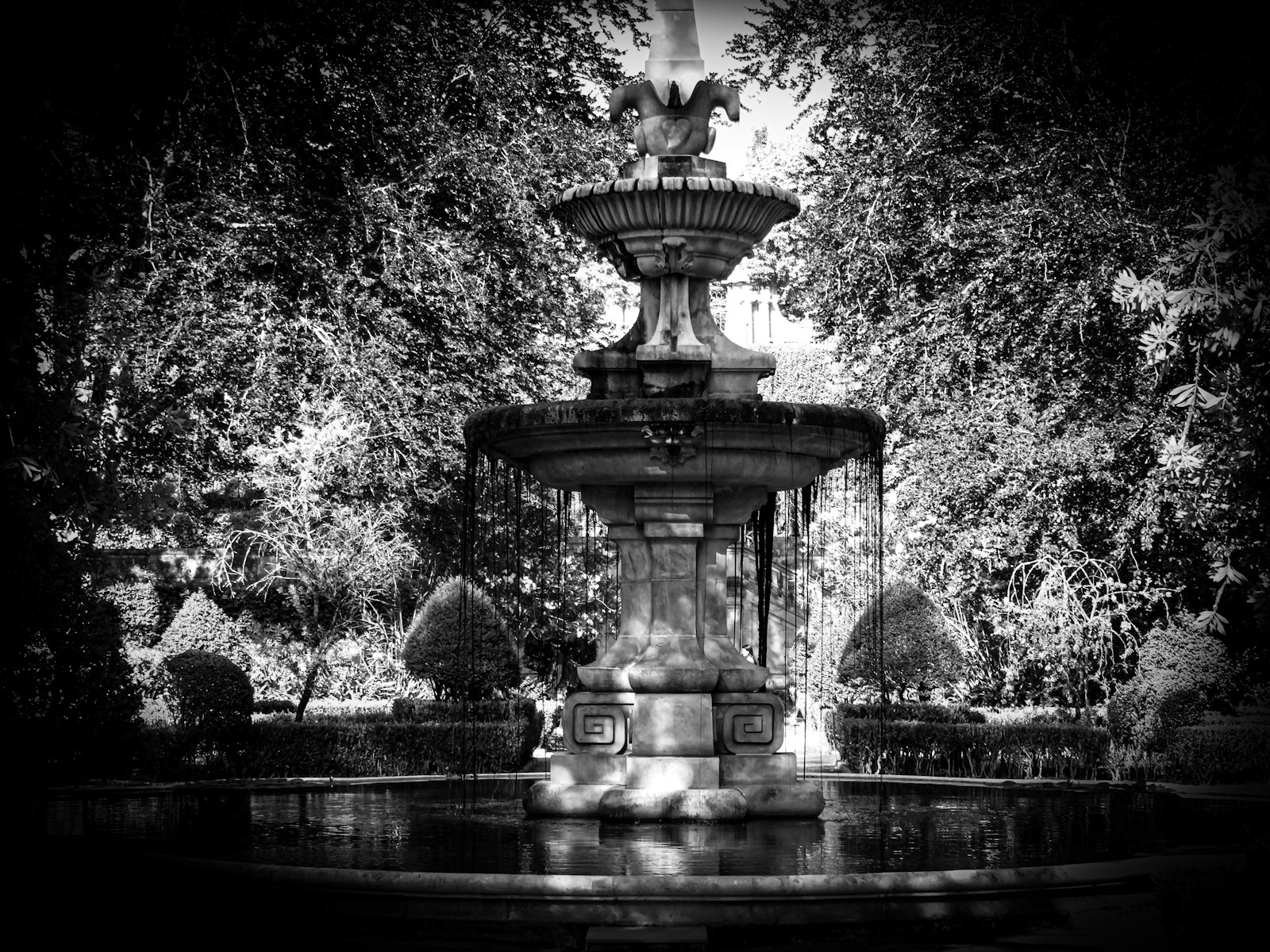 a water fountain in a park