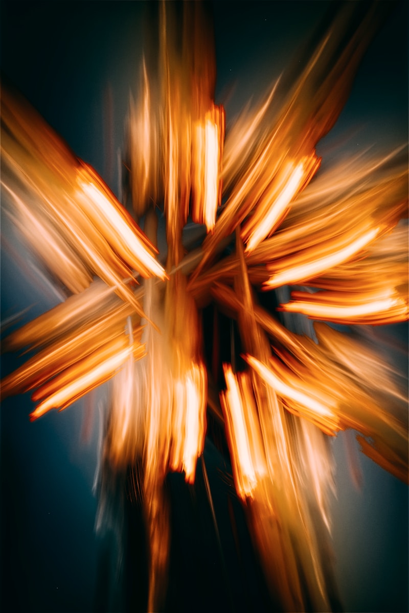 A blurry photo of a cross made of wood
