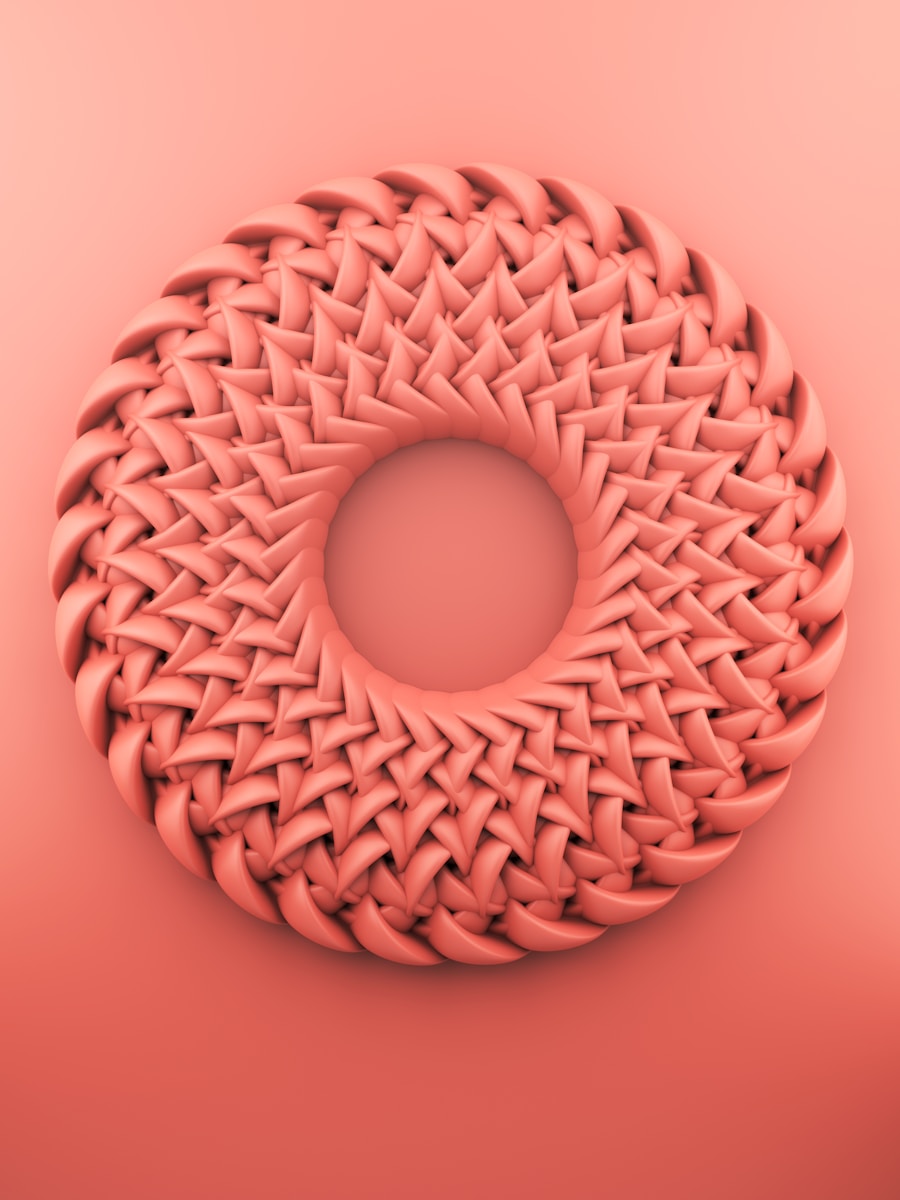 brown round ornament on pink surface